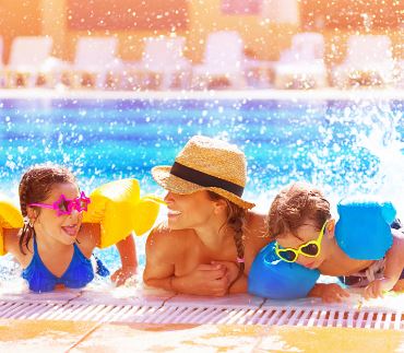 Mom swimming with her kids